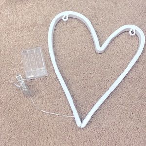 A pink heart shaped led light.